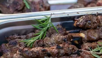 personalized catering service beef skewers at devour event